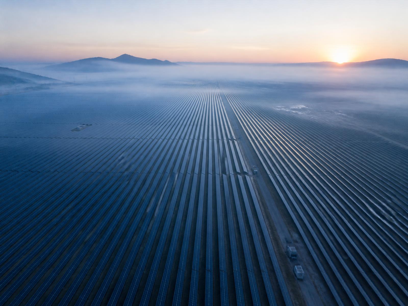 Aerial view of solar and utility infrastructure during an inspection